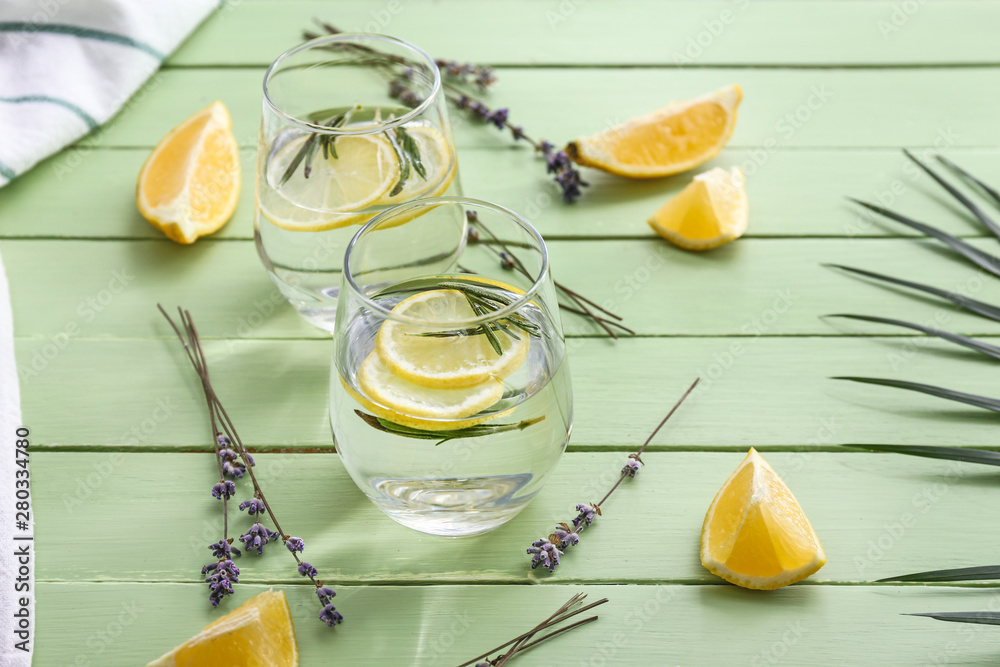 Glasses with lavender lemonade on wooden table