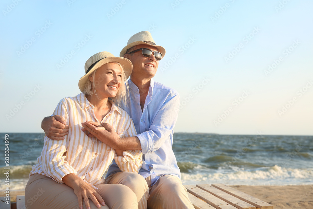 Happy mature couple at sea resort