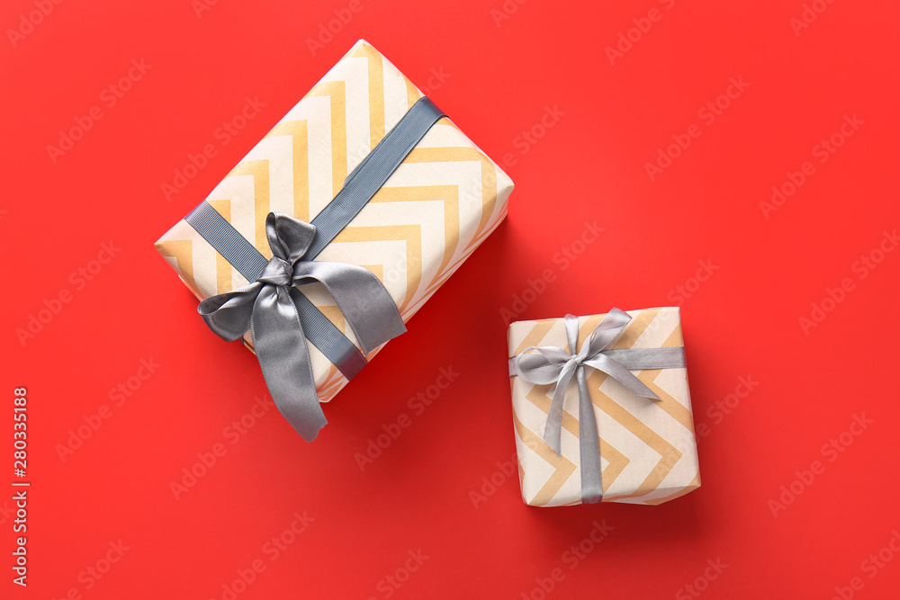 Beautiful gift boxes on color background