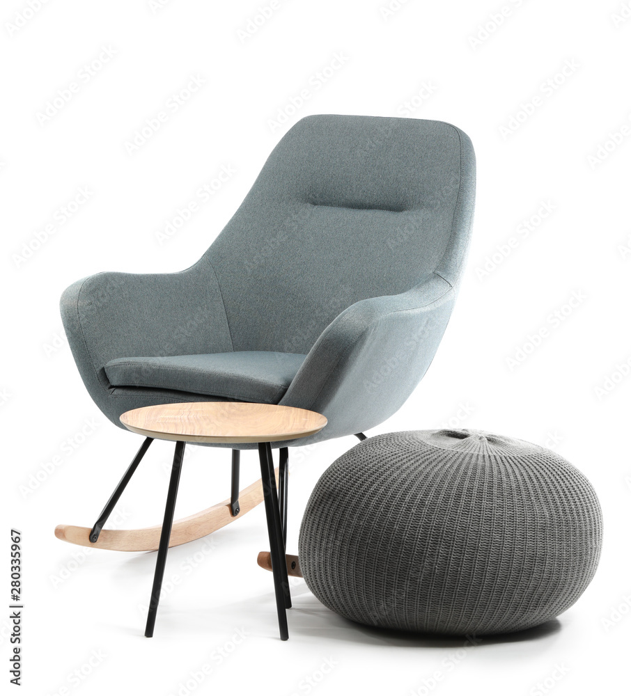 Comfortable armchair, table and pouf on white background