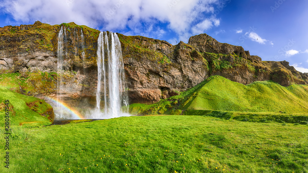 Fantastic Seljalandsfoss waterfall in Iceland during sunny day.