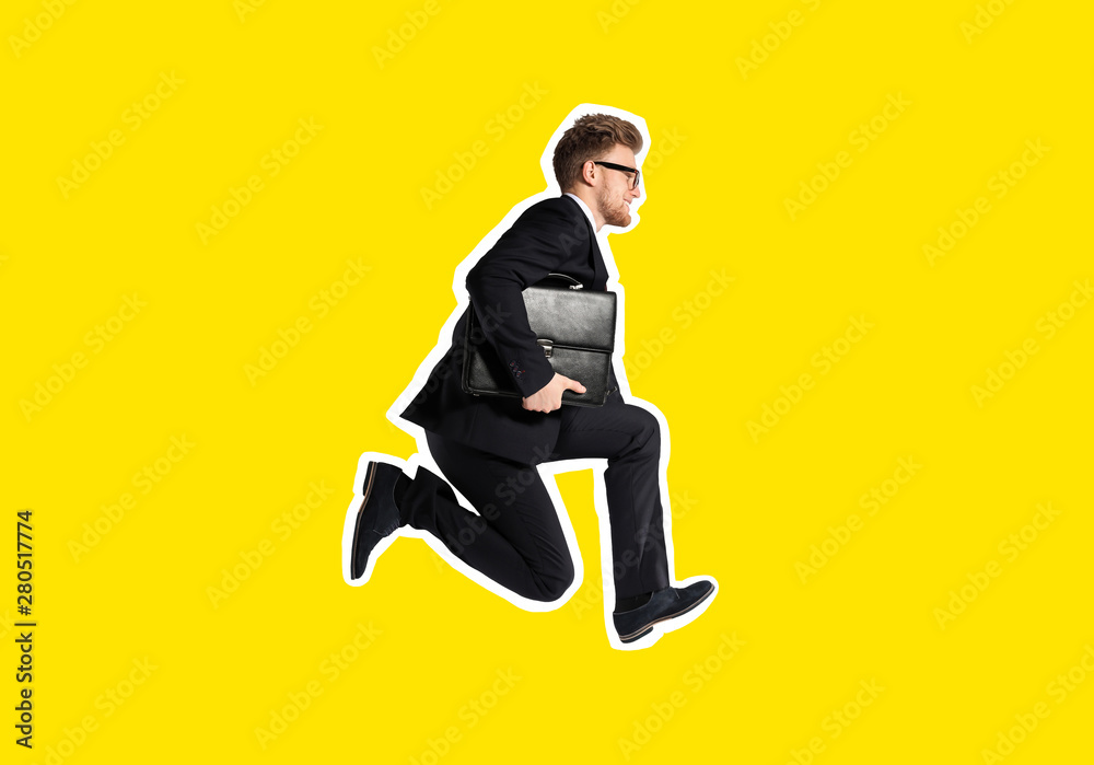 Jumping businessman with stylish briefcase on light background