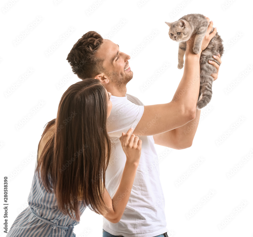 Happy couple with cute cat on white background