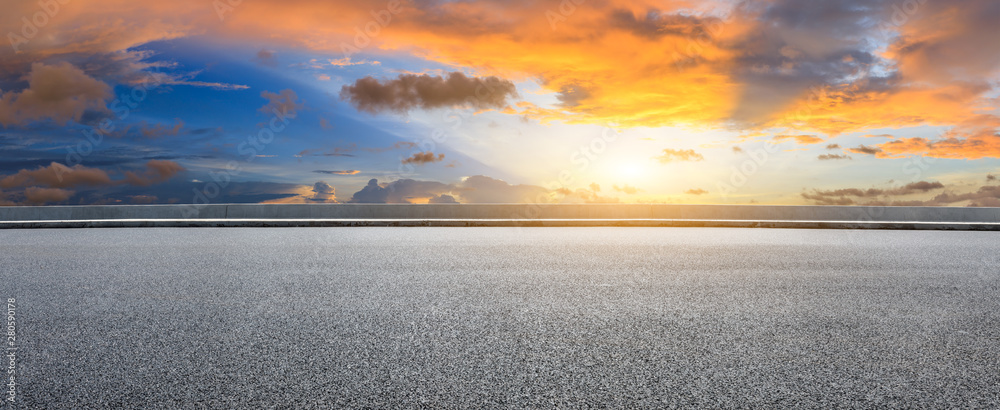 Asphalt highway and beautiful clouds landscape at sunset