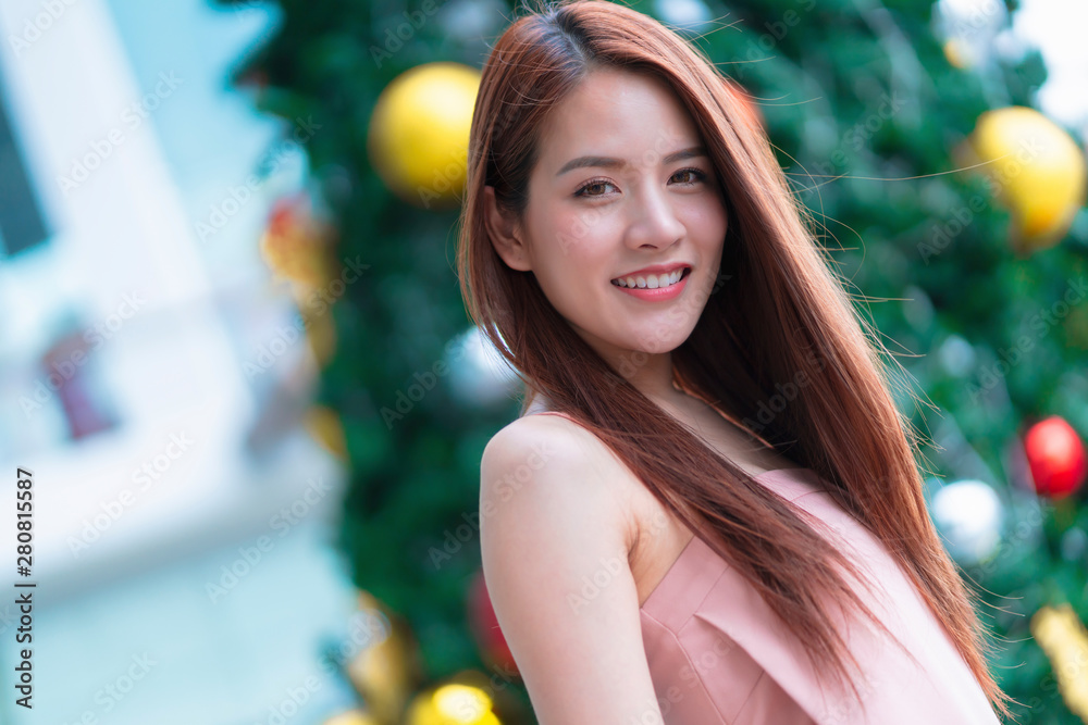 asian beautiful woman long hair fashion portrait pink dress smile with happiness and cheerful