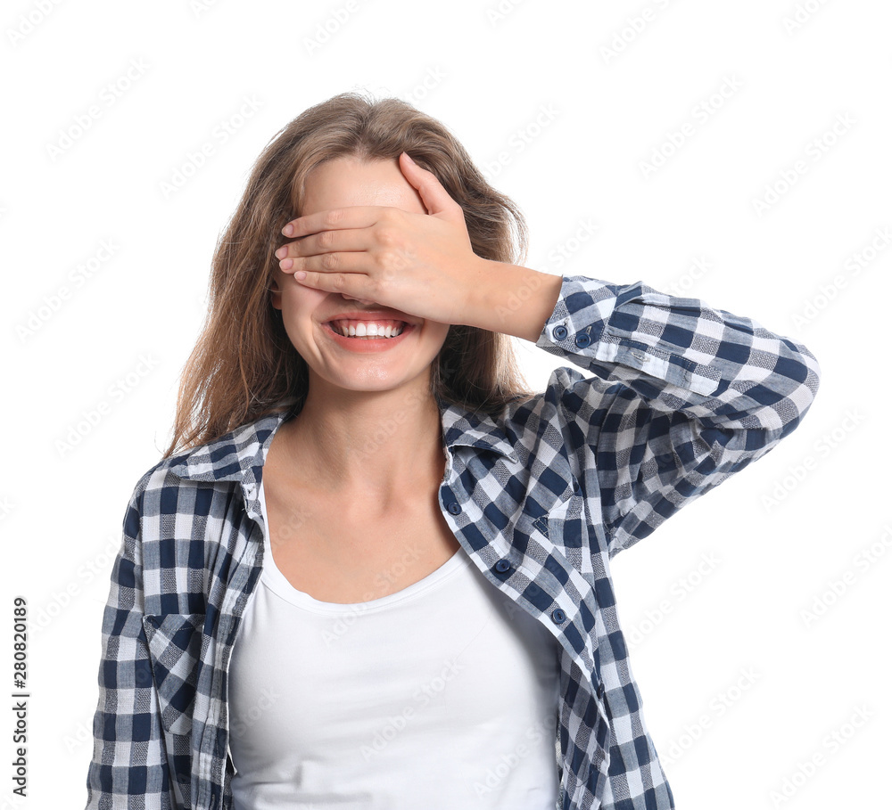 Young woman covering her eyes on white background