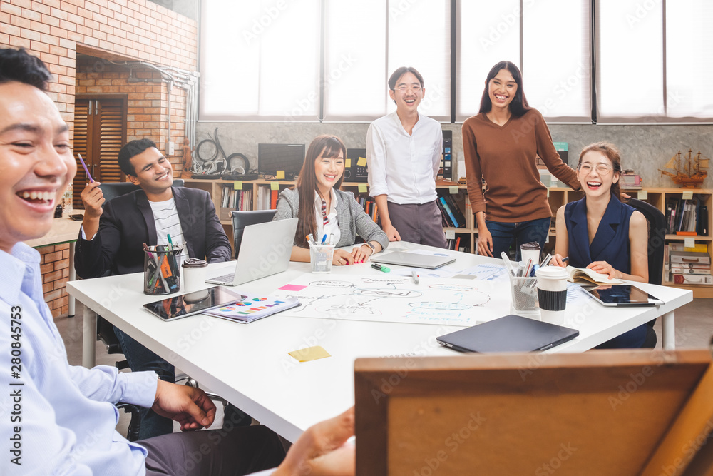 Group of Asian business people and creative designer meeting in office