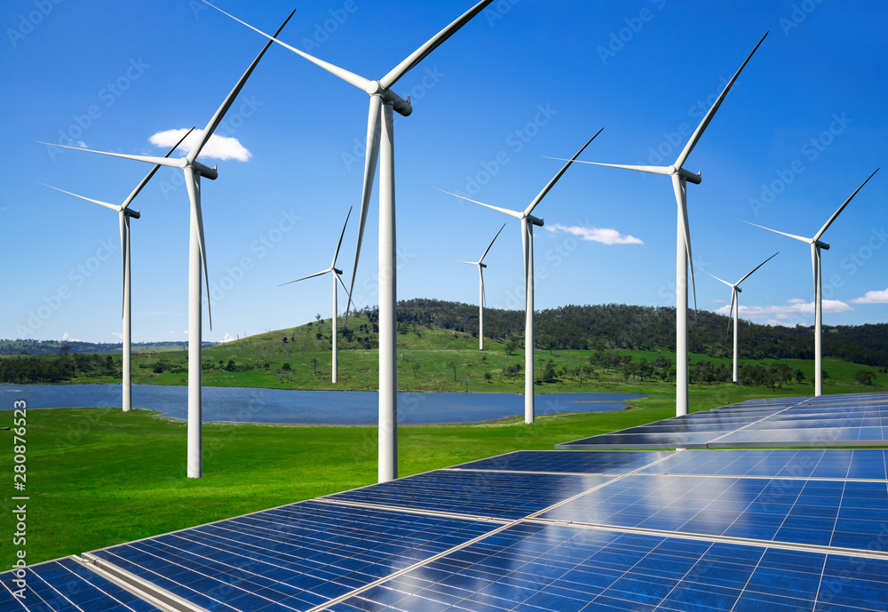 Solar energy panel photovoltaic cell and wind turbine farm power generator in nature landscape for p