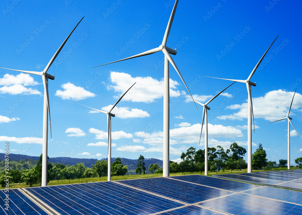 Solar energy panel photovoltaic cell and wind turbine farm power generator in nature landscape for p