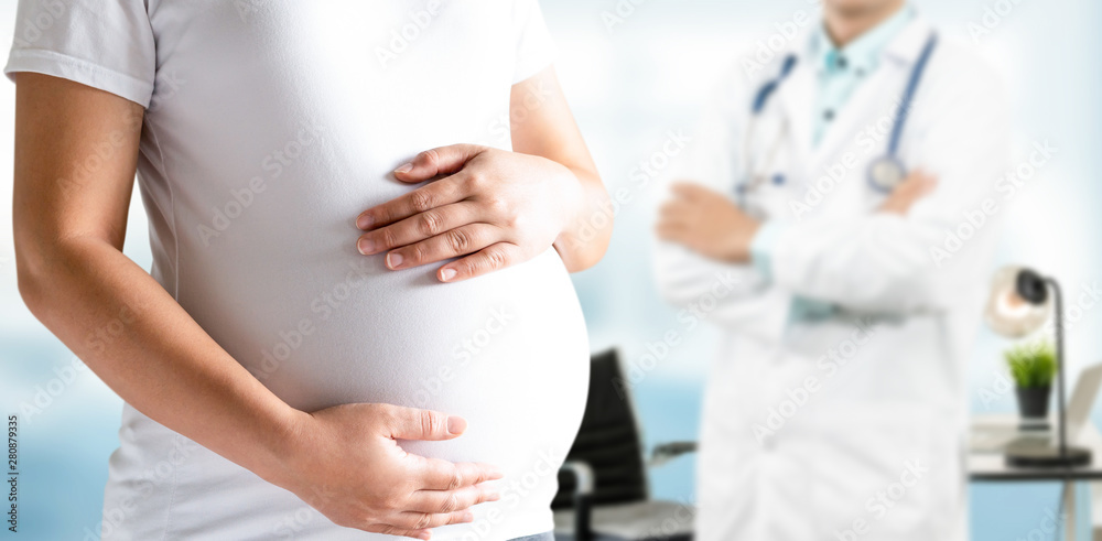 Happy pregnant woman visit gynecologist doctor at hospital or medical clinic for pregnancy consultan