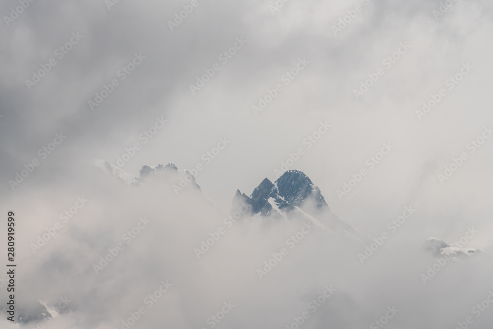 Mountain peak hidden behind clouds