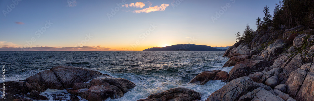 Beautiful Panoramic view of a rocky ocean coast during a vibrant sunny sunset. Taken in Lighthouse P