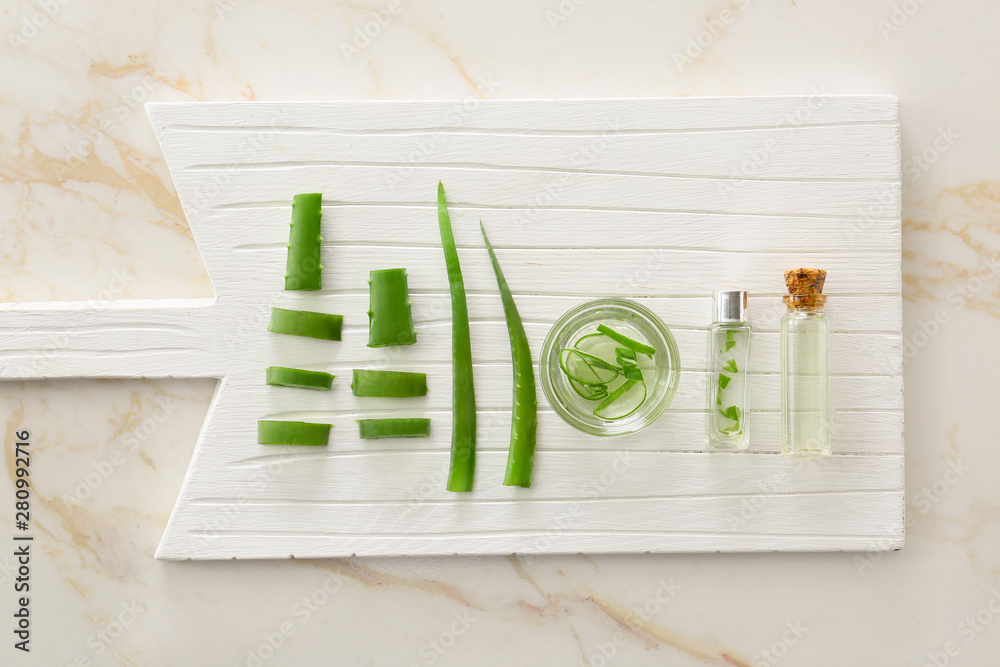 Composition with aloe vera on white wooden board