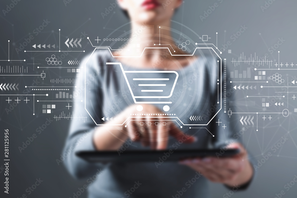 Online shopping theme with business woman using a tablet computer