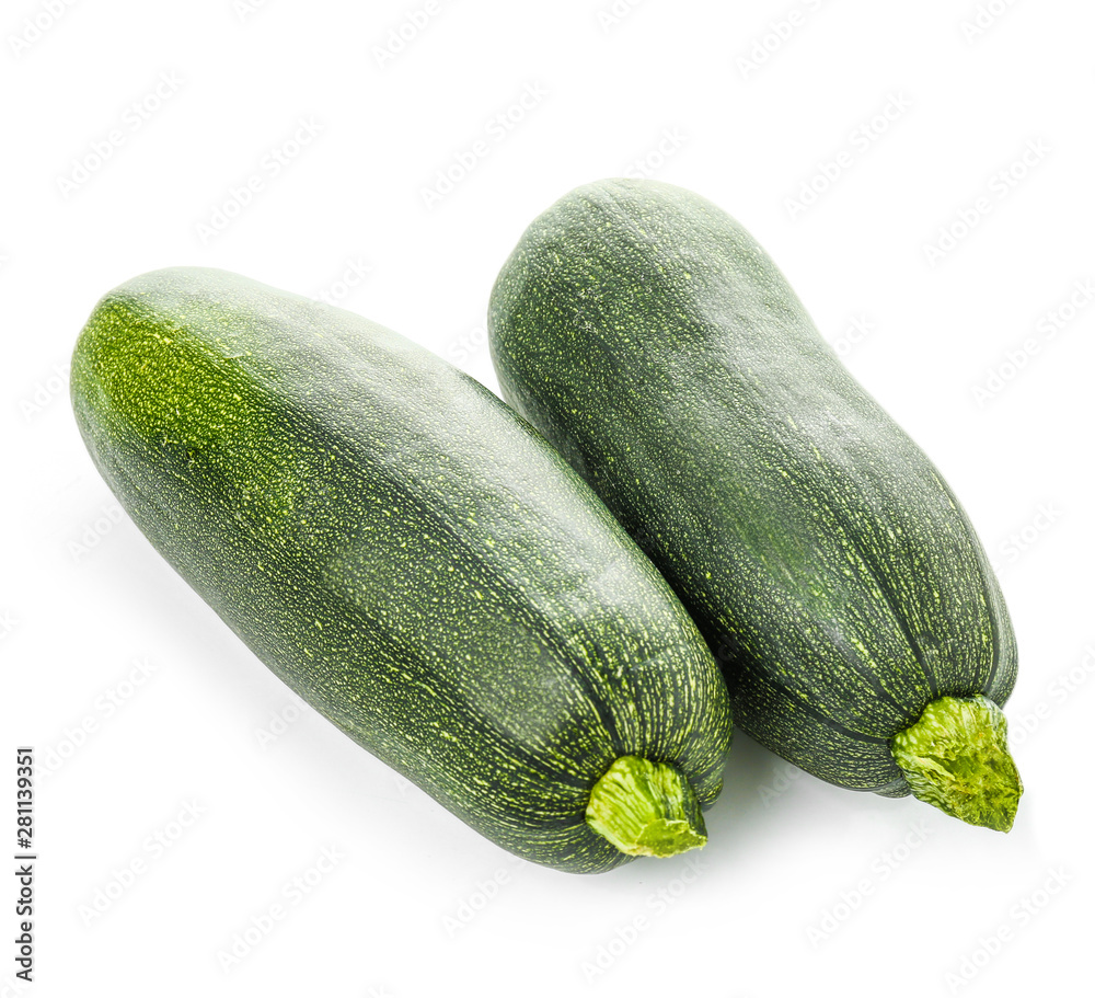 Fresh zucchini squashes on white background