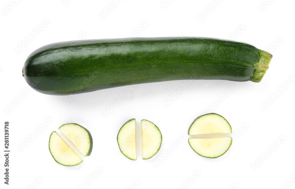 Fresh zucchini squash with pieces on white background