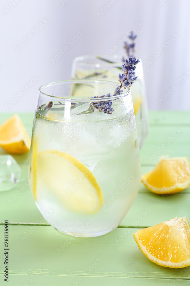 Glasses with lavender lemonade on wooden table