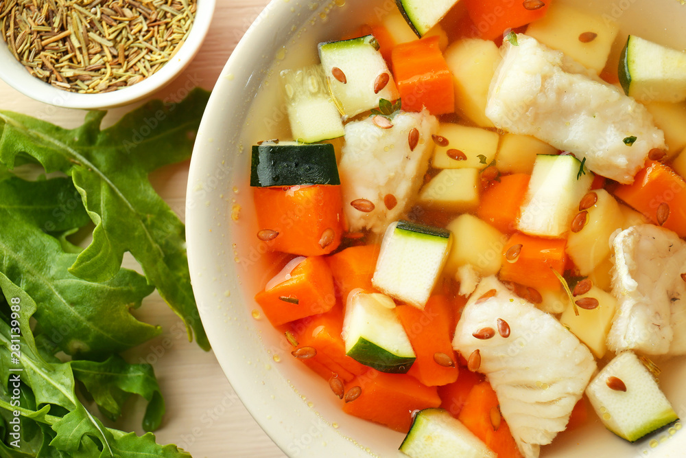 Bowl of tasty soup on table, closeup