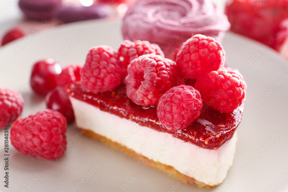 Tasty raspberry cheesecake on plate, closeup