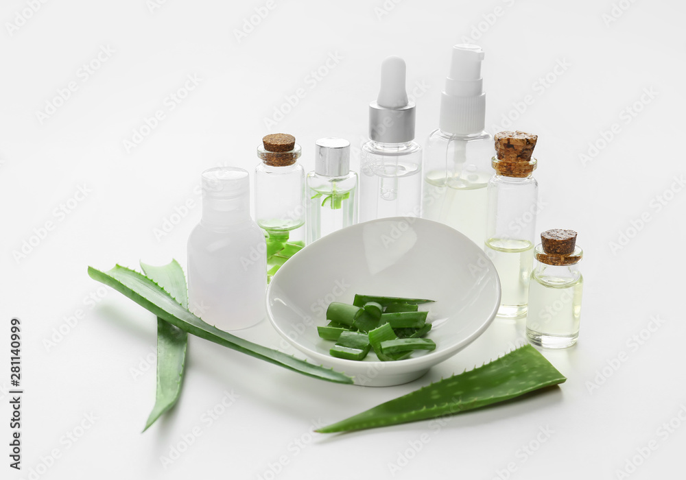 Fresh aloe with essential oil on white background