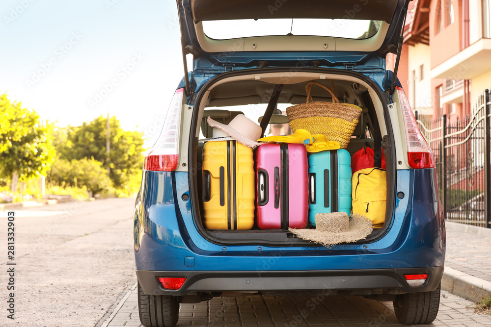 Modern car with luggage outdoors