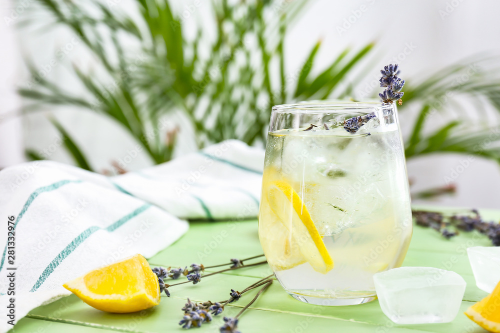 Glass with lavender lemonade on wooden table