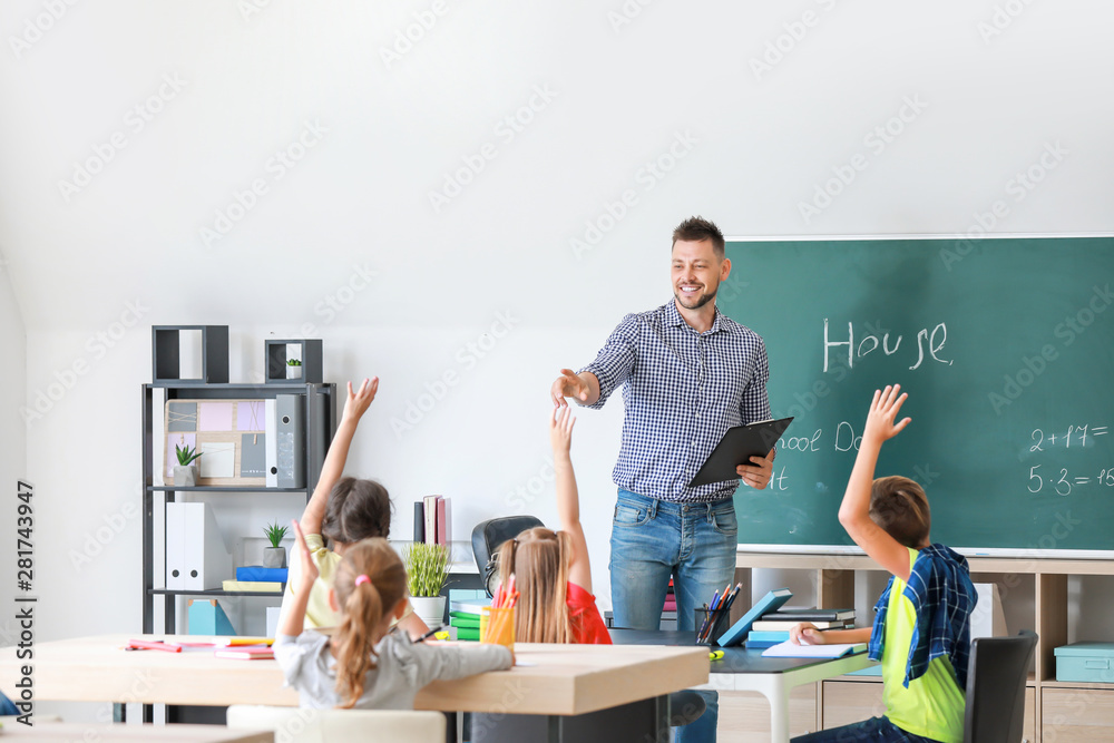 Teacher conducting lesson in classroom