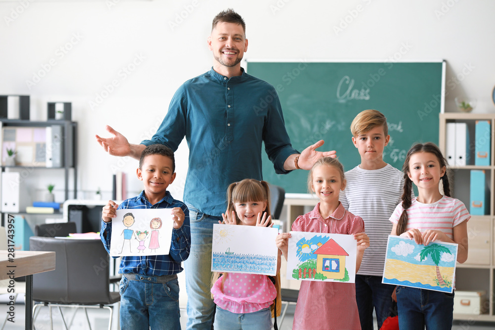 Cute children with teacher in classroom