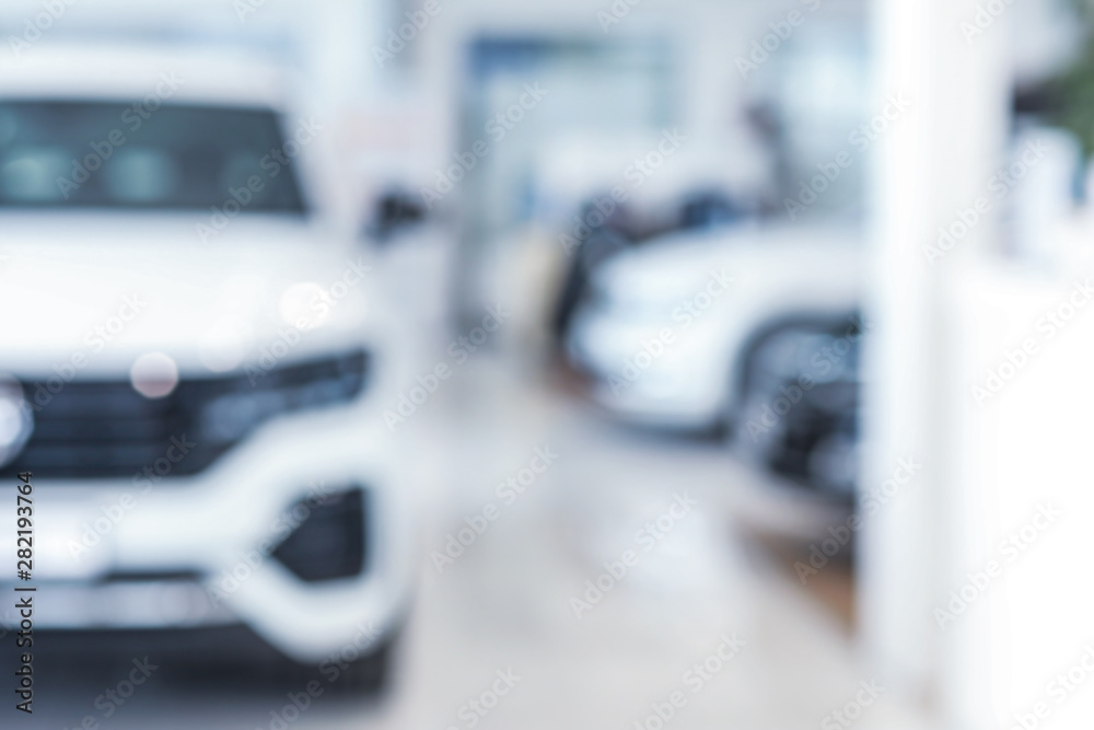 Blurred interior of modern car showroom