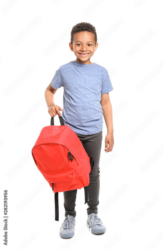 Cute African-American schoolboy on white background