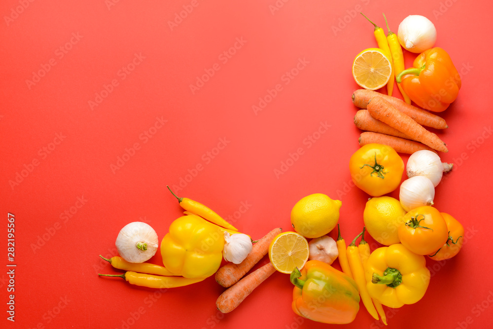 Assortment of fresh vegetables on color background