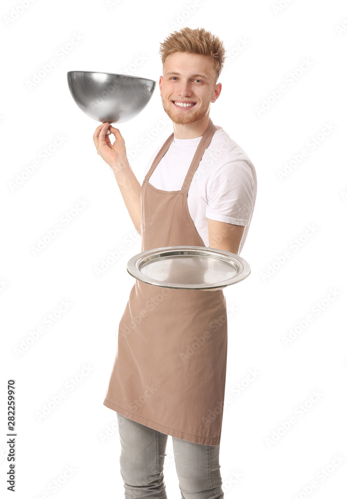 Handsome male chef with tray and cloche on white background