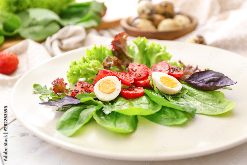 Plate with fresh tasty salad on table, closeup