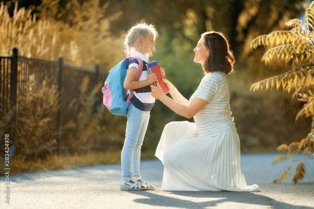 Parent and pupil go to school