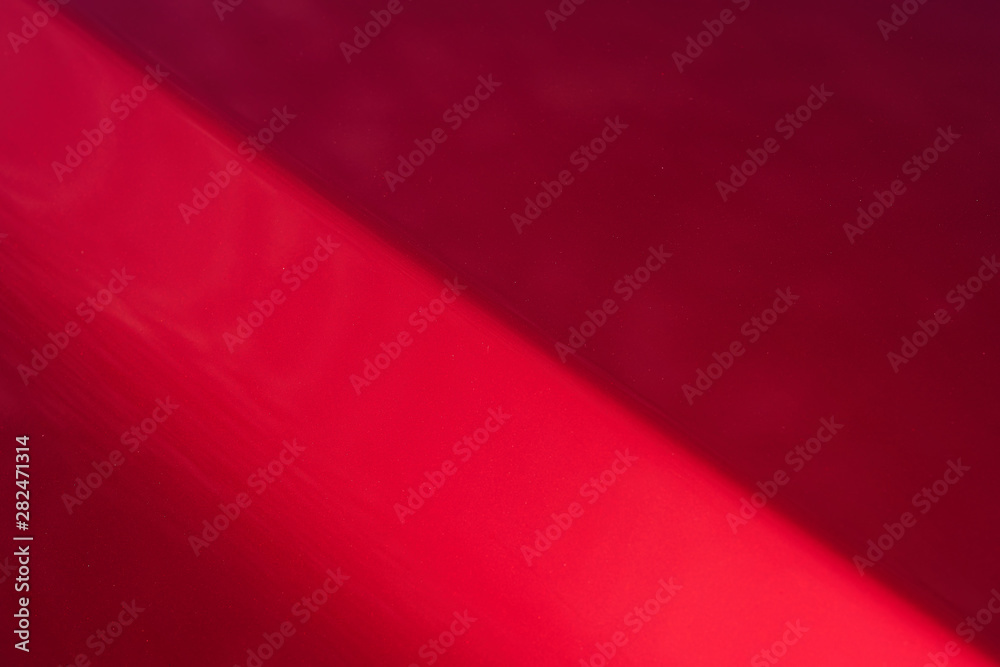 Close up detail of red metallic paint coating car body