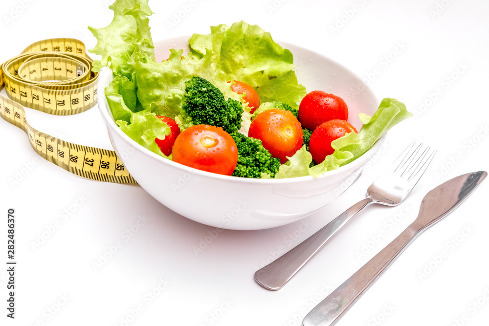 concept diet fresh vegetables on plate at white background