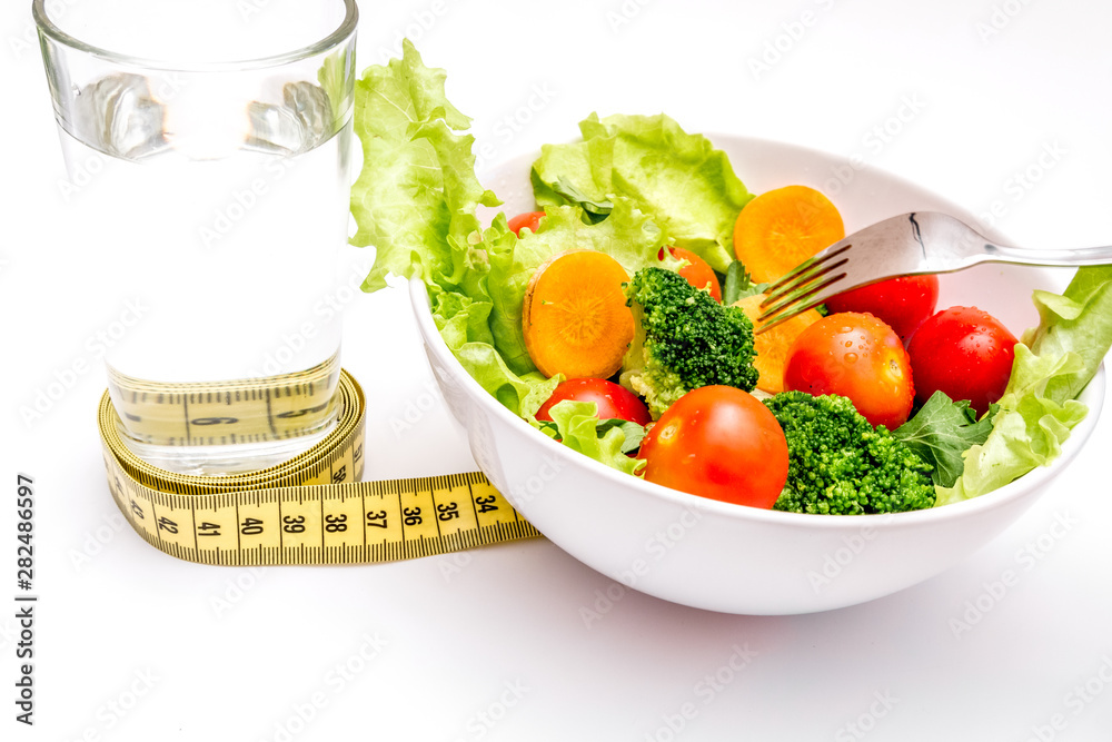 concept diet fresh vegetables on plate at white background