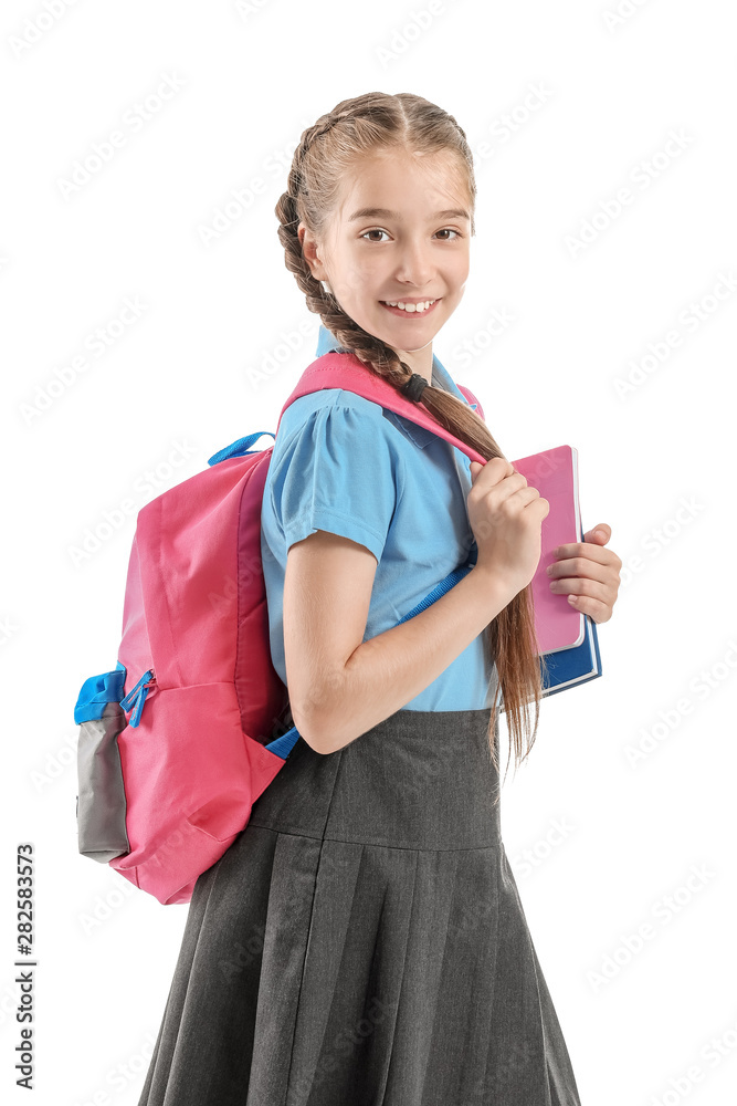 Cute little schoolgirl on white background