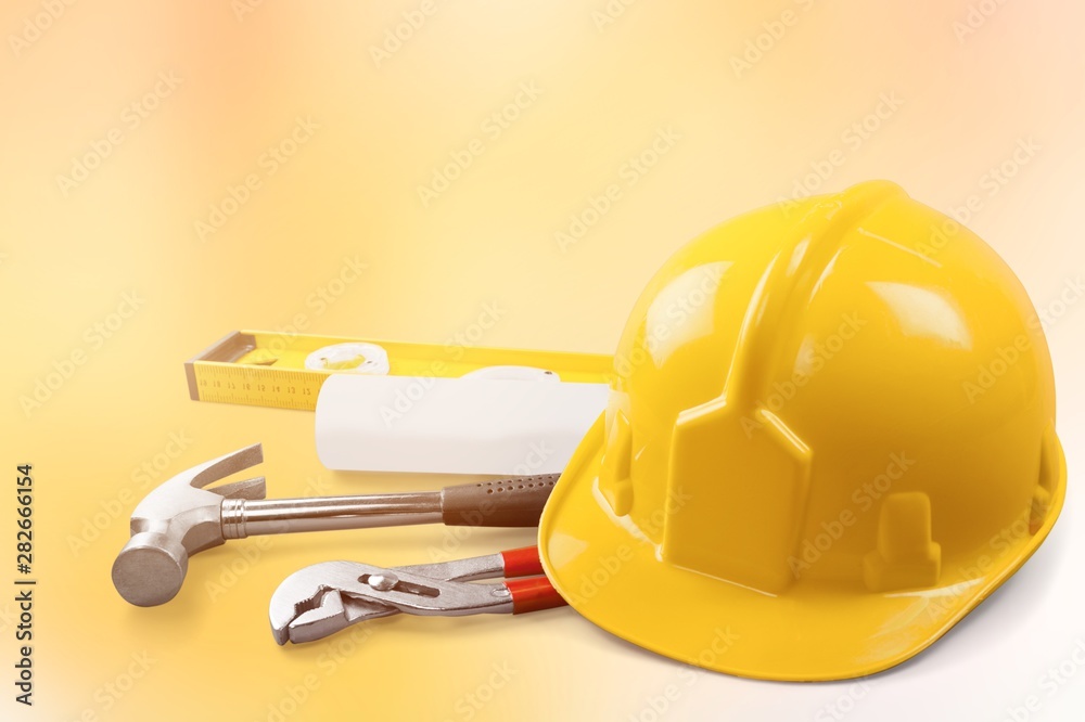 Yellow hard hat and leather work gloves