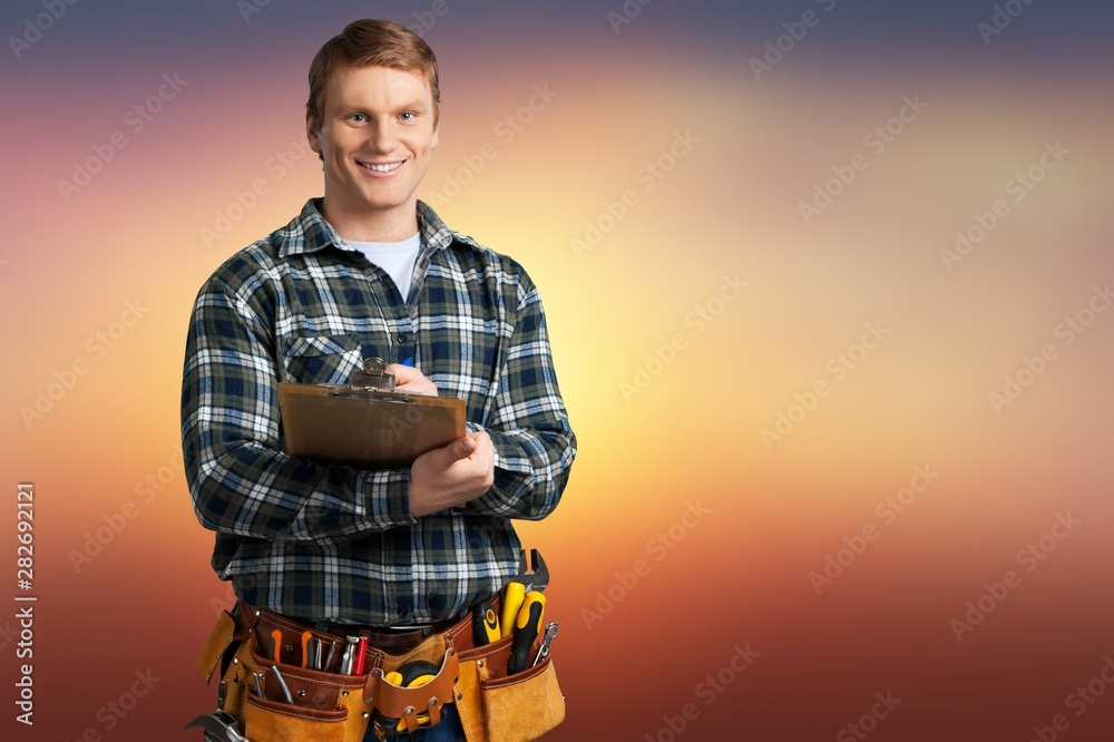 Worker with a tool belt. Isolated over white background.