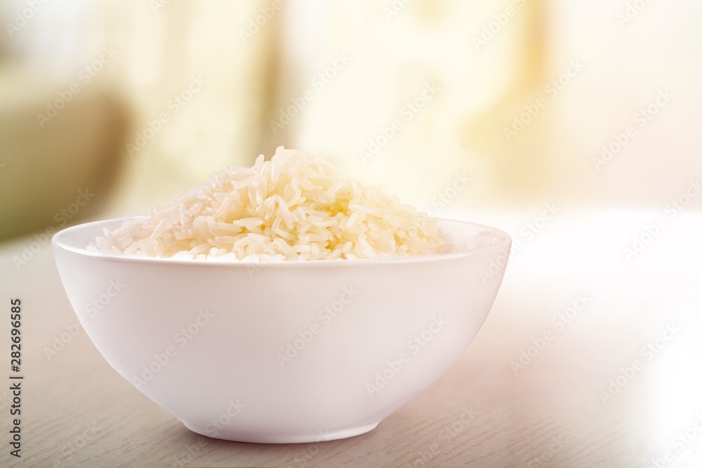 Rice in a bowl on a white background