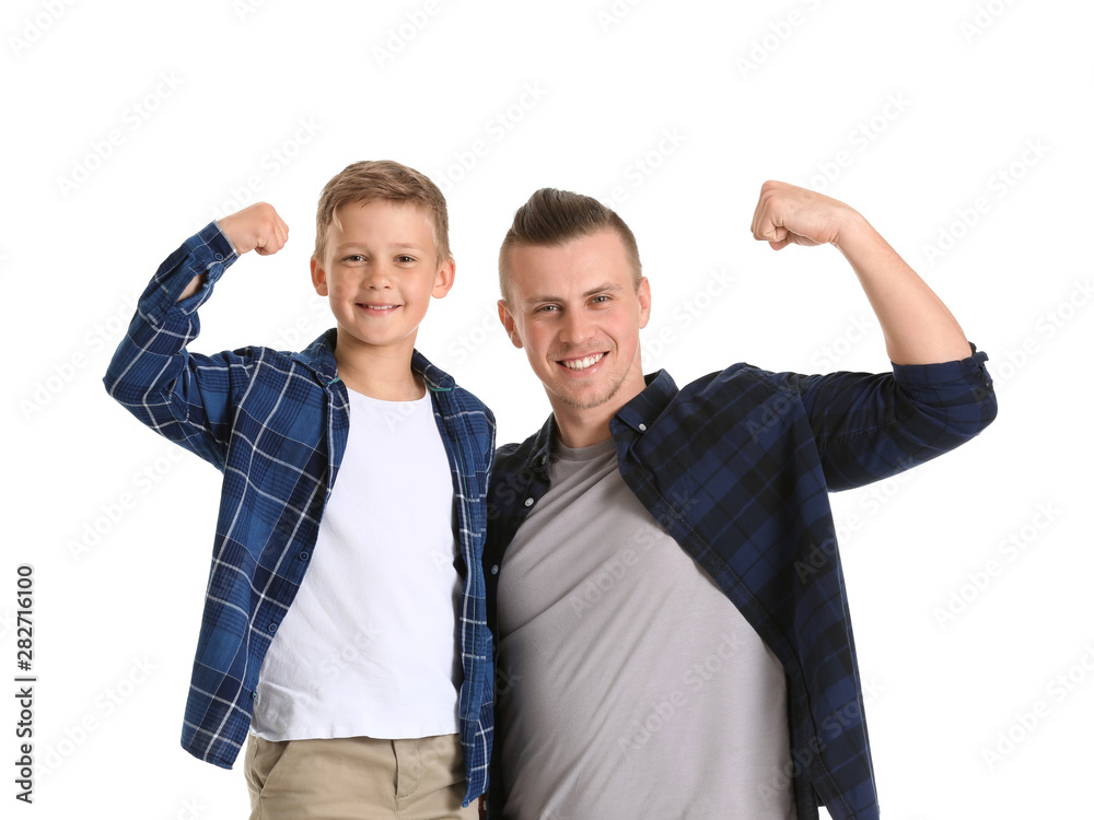 Portrait of happy father and son on white background