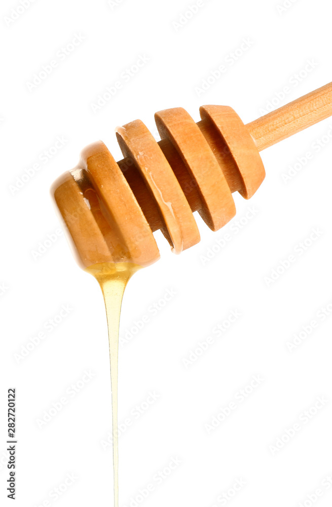 Wooden honey dipper on white background