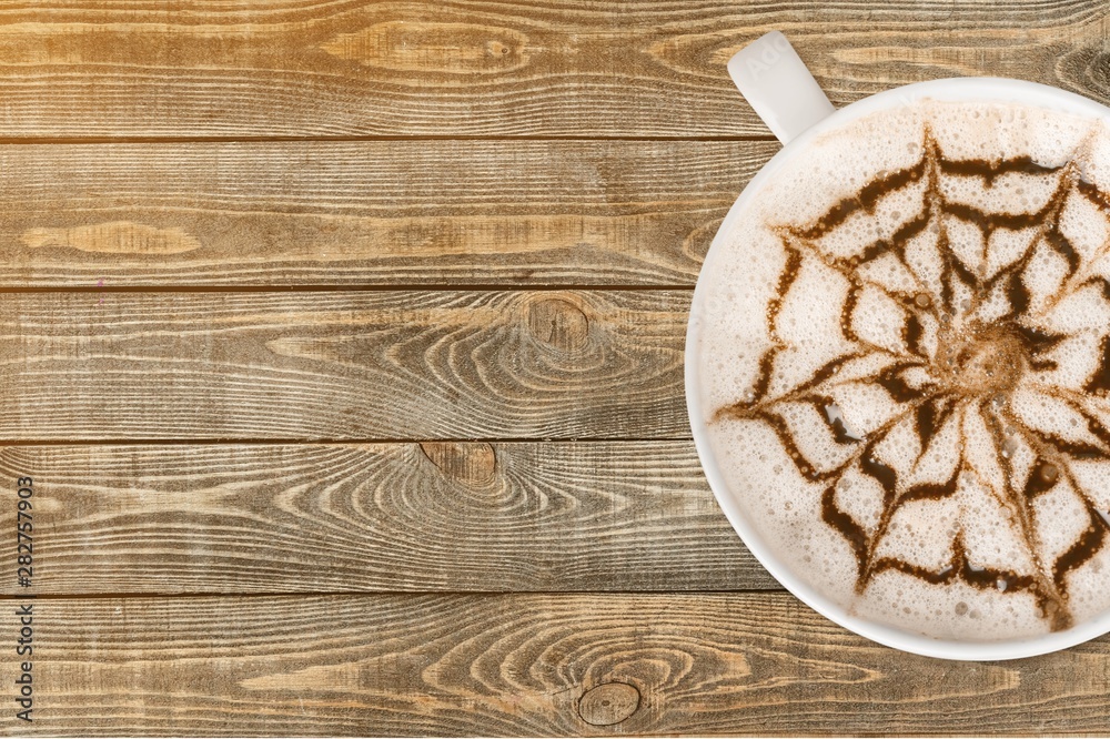 Cup of coffee on wooden background