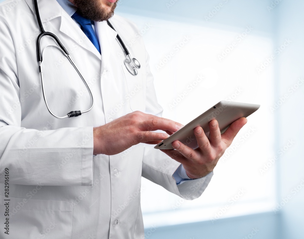 Doctor using digital tablet.