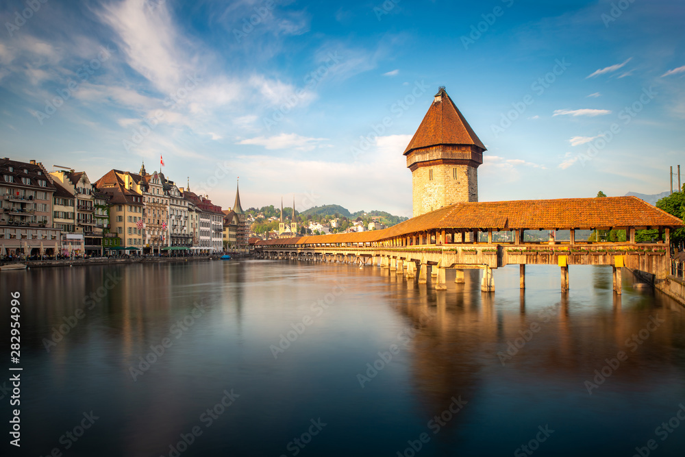 Sunset in historic city center of Lucerne with famous Chapel Bridge and lake Lucerne in Canton of Lu