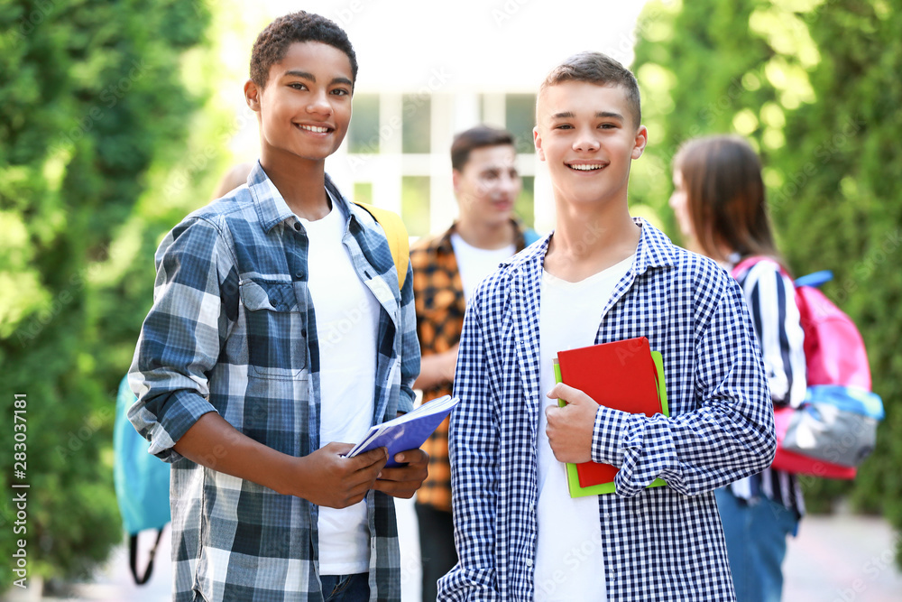 Portrait of young students outdoors