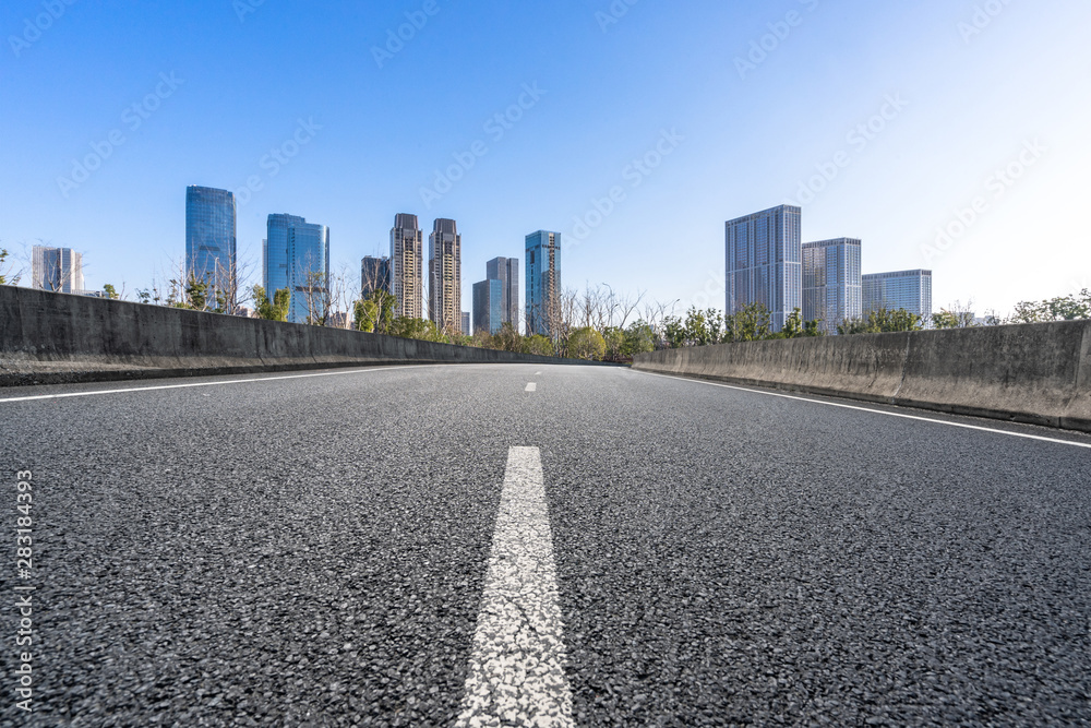 empty road with city skyline