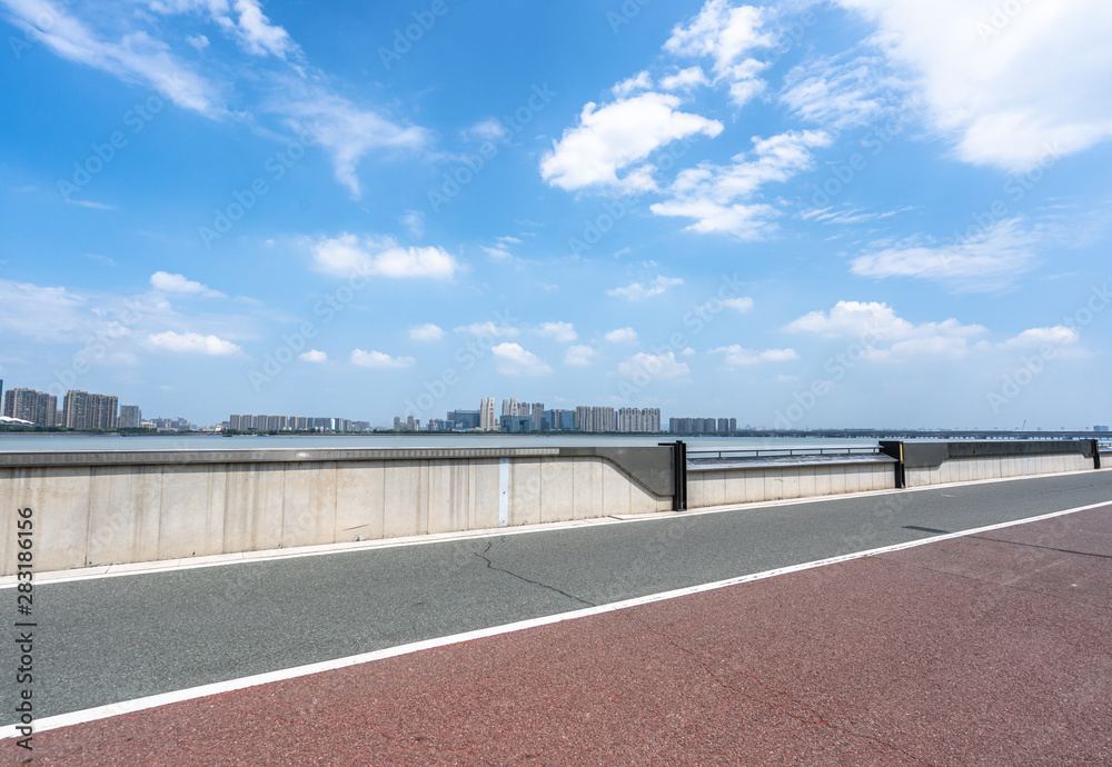 empty road with city skyline