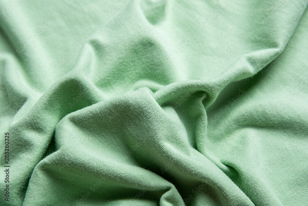 Green cotton knit fabric texture material close-up